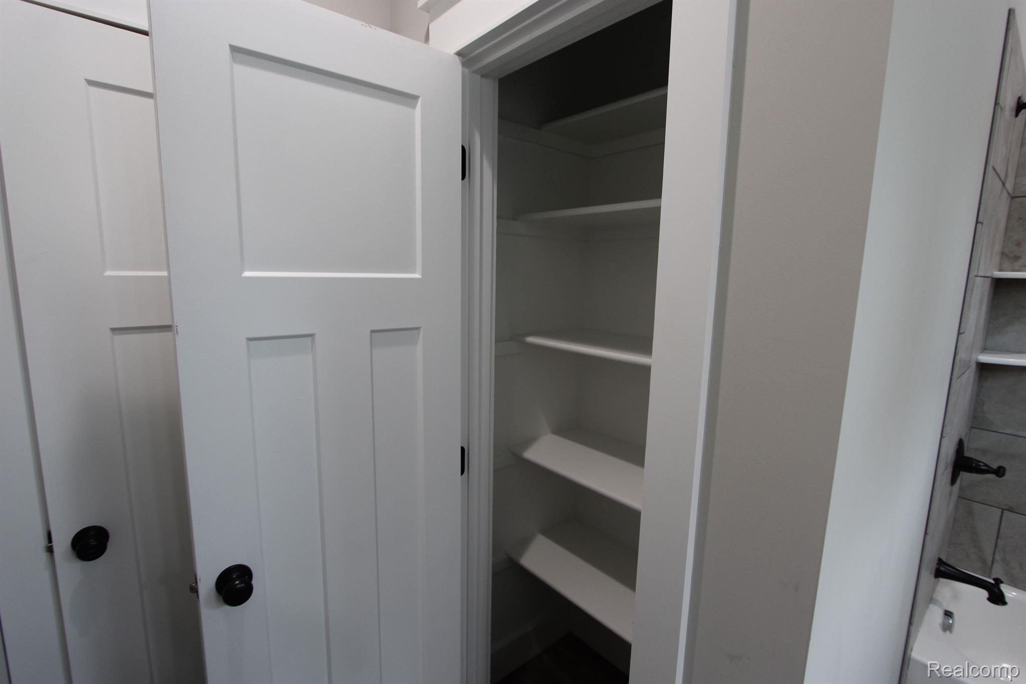 2975 East Coon Lake Road Howell, MI 48843 - Photo 88 of 175 FULL BATH LINEN CLOSET