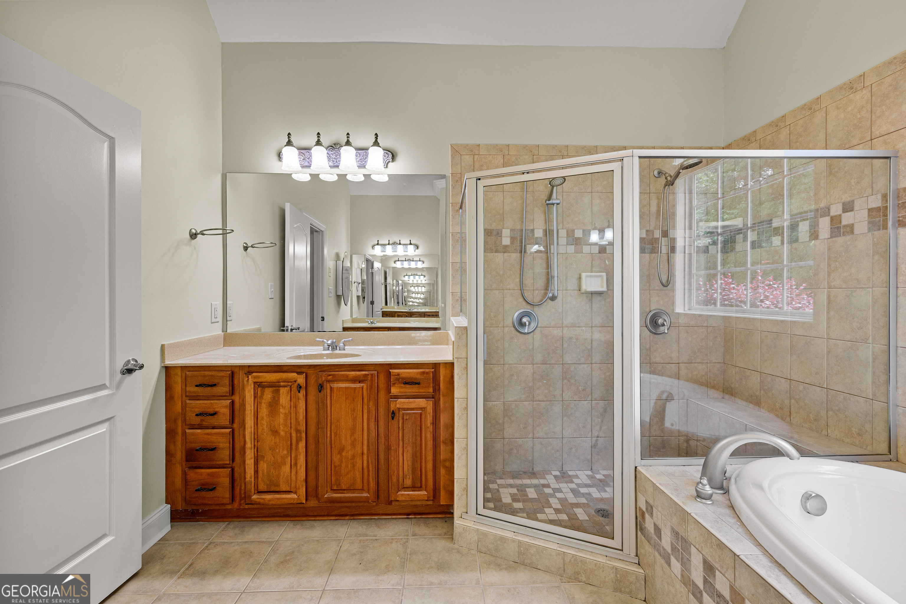120 Shankhill Ridge Tyrone, GA 30290 - Photo 31 of 53 a spacious bathroom with a tub sink and shower