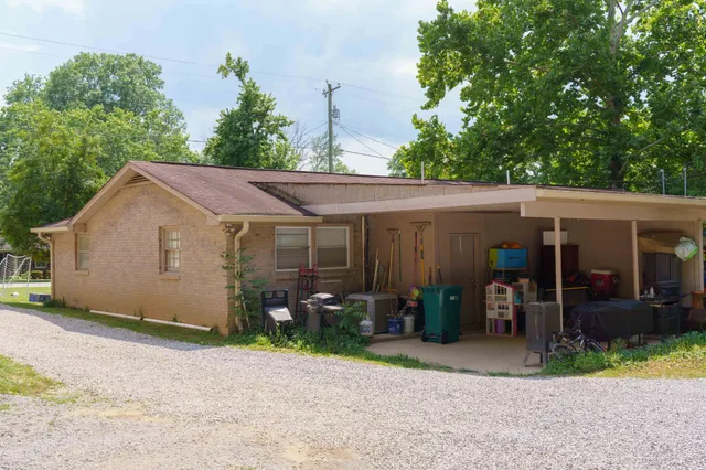 a view of swimming pool with sitting area and furniture