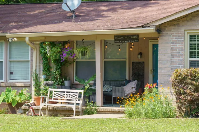a view of a chairs and table in a patio