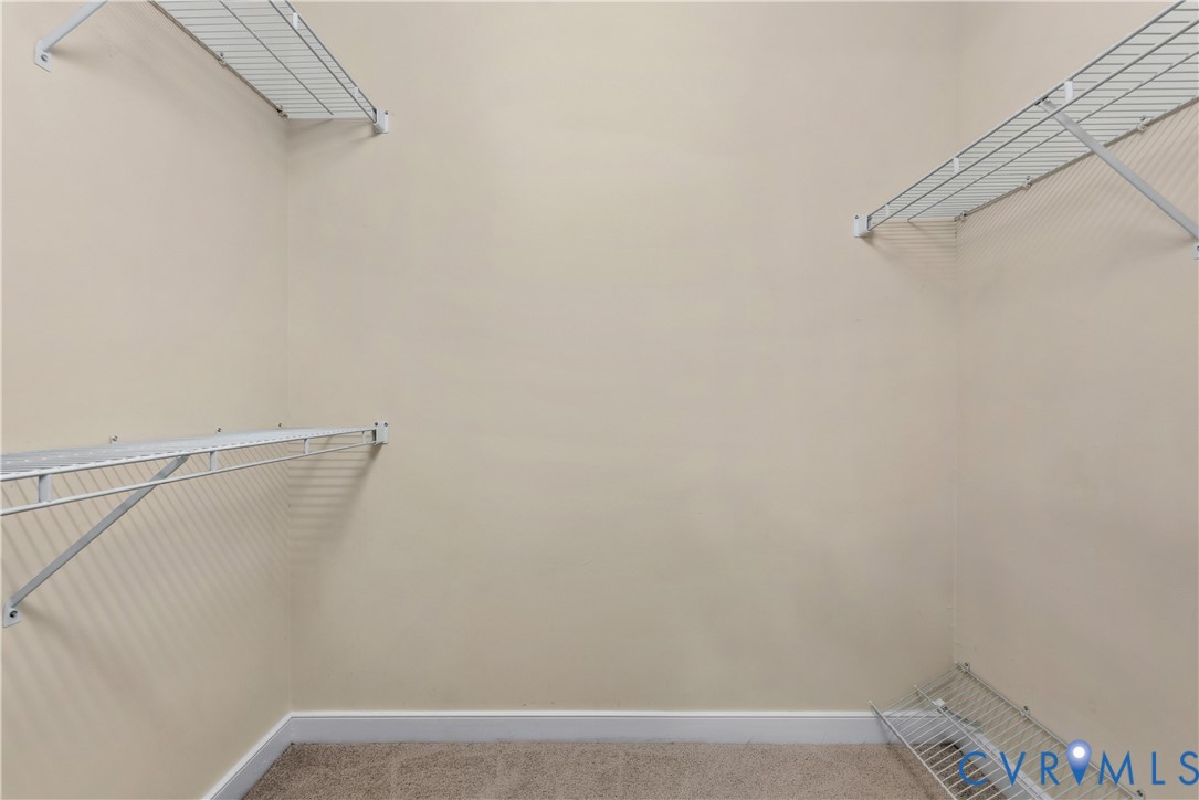 14308 Chimney House Road Midlothian, VA 23112 - Photo 30 of 52 Walk-in closet featuring light beige walls and lig