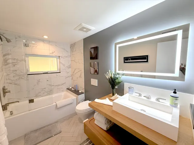 a view of a backyard with sitting area