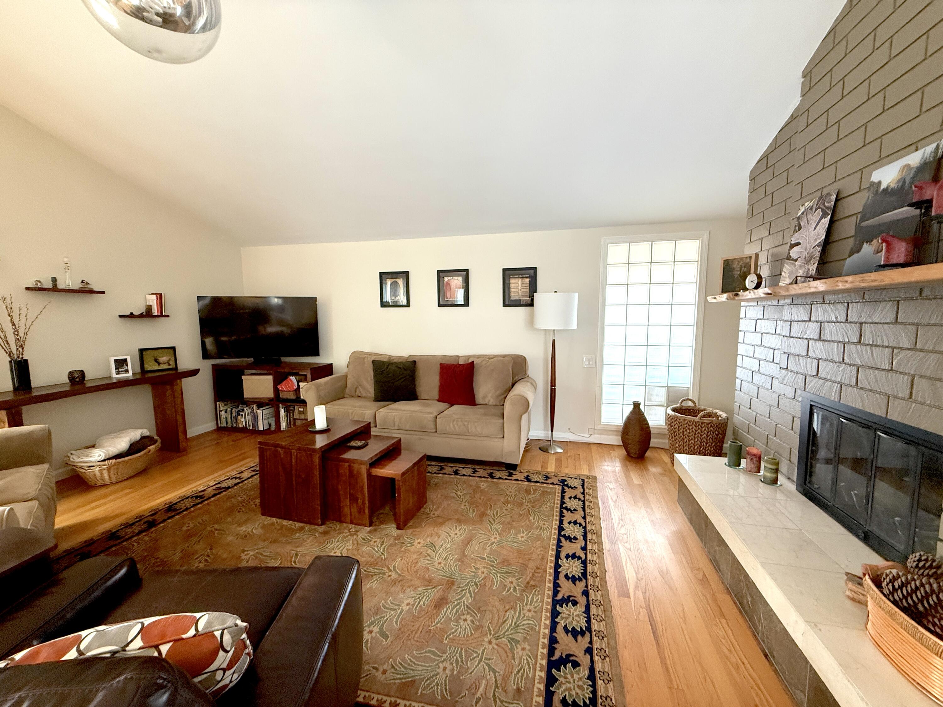 345 North Ontare Road Santa Barbara, CA 93105 - Photo 4 of 14 a living room with fireplace furniture and a flat screen tv