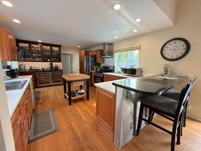 a kitchen with a table chairs and a stove