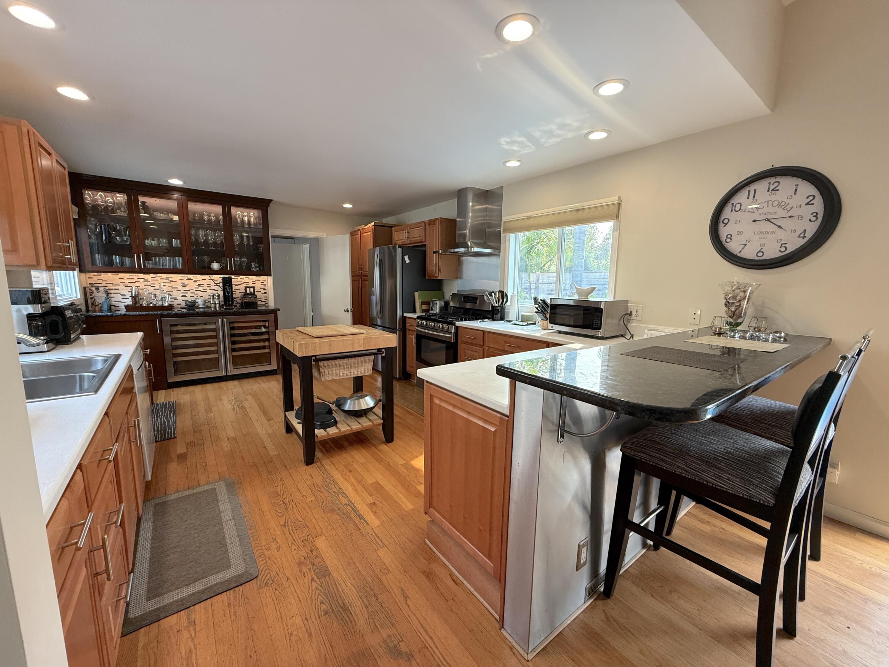 345 North Ontare Road Santa Barbara, CA 93105 - Photo 5 of 14 a kitchen with a table chairs and a stove