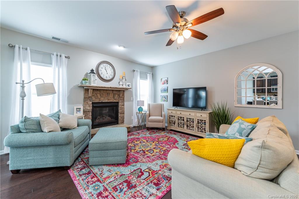 79362 Ridgehaven Road Lancaster, SC 29720 - Photo 15 of 37 a living room with furniture fireplace and a flat screen tv