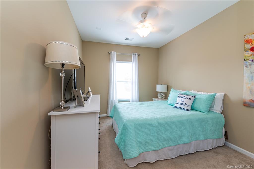 79362 Ridgehaven Road Lancaster, SC 29720 - Photo 17 of 37 a bedroom with a bed and a mirror