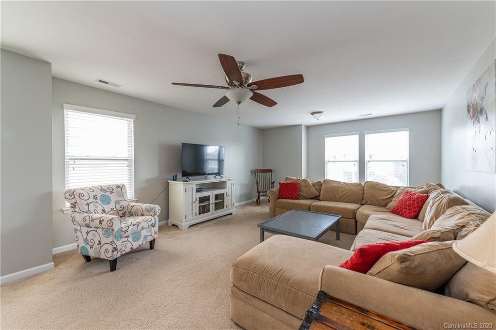 79362 Ridgehaven Road Lancaster, SC 29720 - Photo 19 of 37 a living room with furniture and a flat screen tv