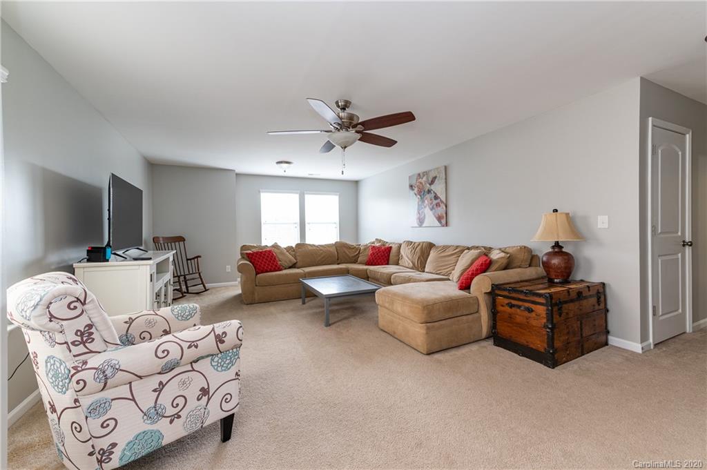 79362 Ridgehaven Road Lancaster, SC 29720 - Photo 20 of 37 a living room with furniture and a ceiling fan