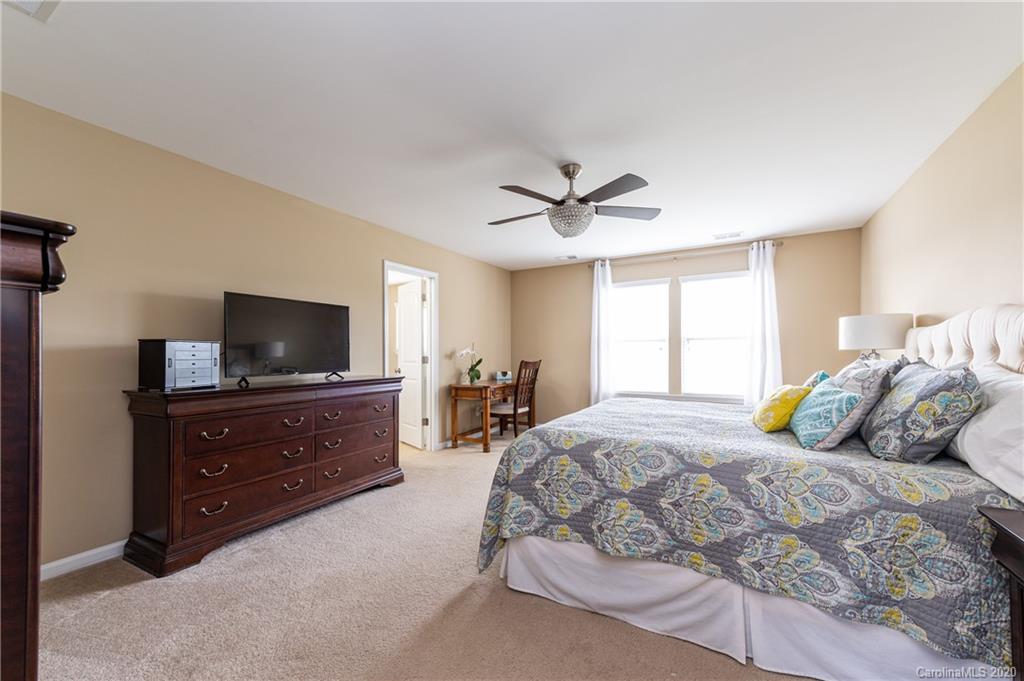 79362 Ridgehaven Road Lancaster, SC 29720 - Photo 21 of 37 a bedroom with a bed and a flat screen tv