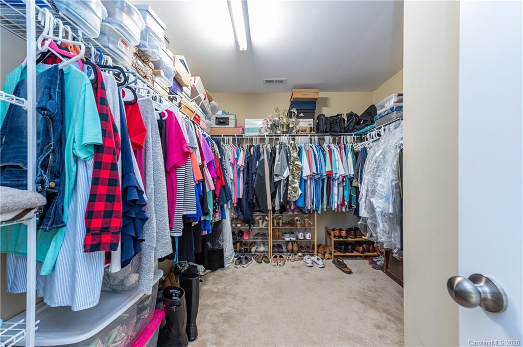 79362 Ridgehaven Road Lancaster, SC 29720 - Photo 25 of 37 a view of walk in closet with clothes