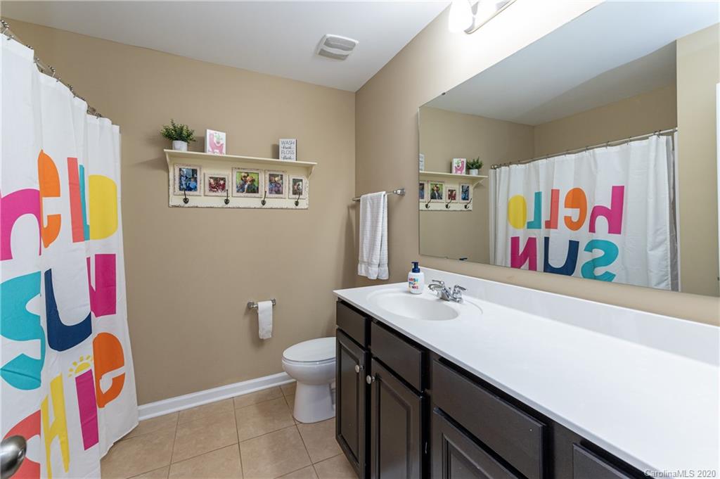 79362 Ridgehaven Road Lancaster, SC 29720 - Photo 28 of 37 a bathroom with a sink a toilet and vanity