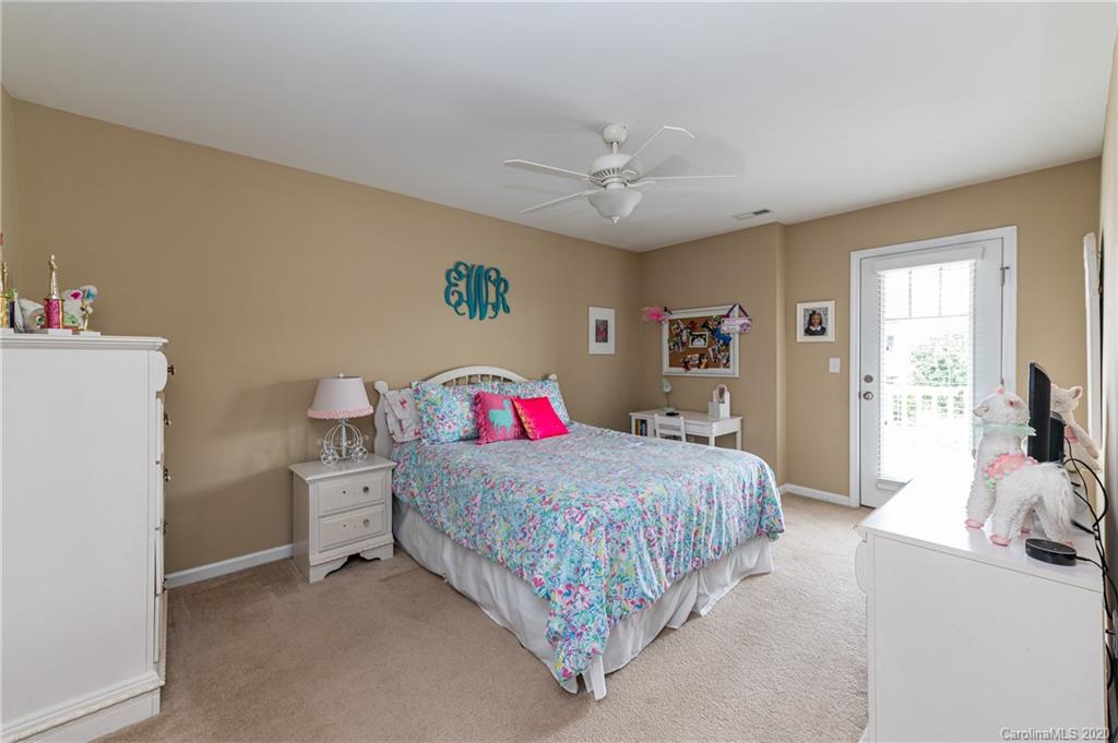 79362 Ridgehaven Road Lancaster, SC 29720 - Photo 30 of 37 a bedroom with a bed and a chandelier