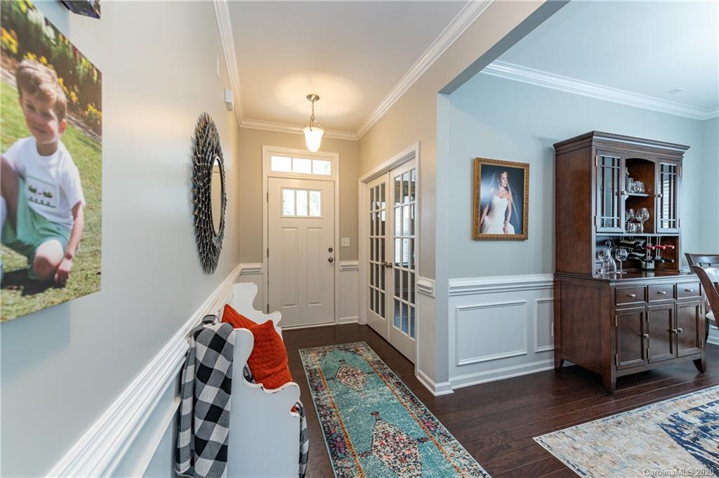 79362 Ridgehaven Road Lancaster, SC 29720 - Photo 4 of 37 a hallway with furniture and wooden floor