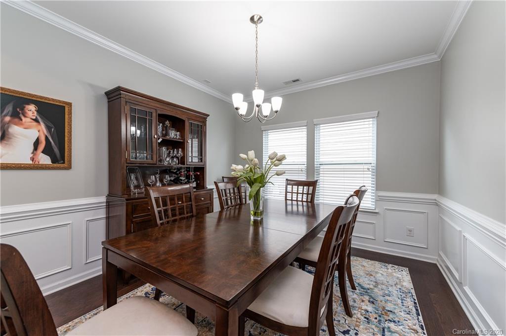 79362 Ridgehaven Road Lancaster, SC 29720 - Photo 6 of 37 a dining room with furniture a rug and wooden floor