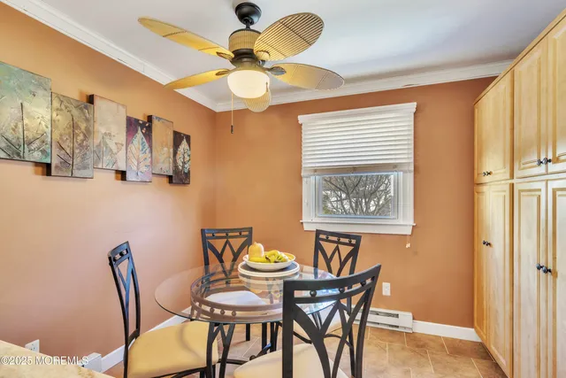 a view of a dining room with furniture and chandelier