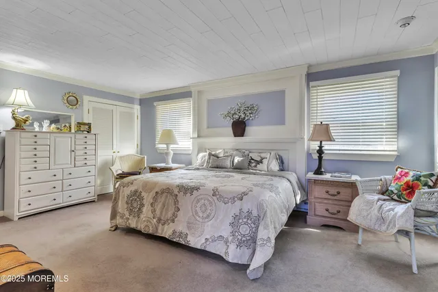 a spacious bedroom with a bed and a window