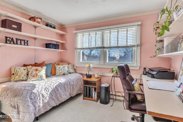 a bedroom with a bed furniture and a window