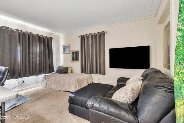 a living room with a couch and a flat screen tv