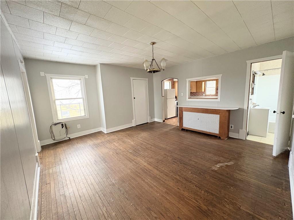 1604 Ridge Avenue, Unit 2 Braddock, PA 15104 - Photo 3 of 6 an empty room with wooden floor and windows