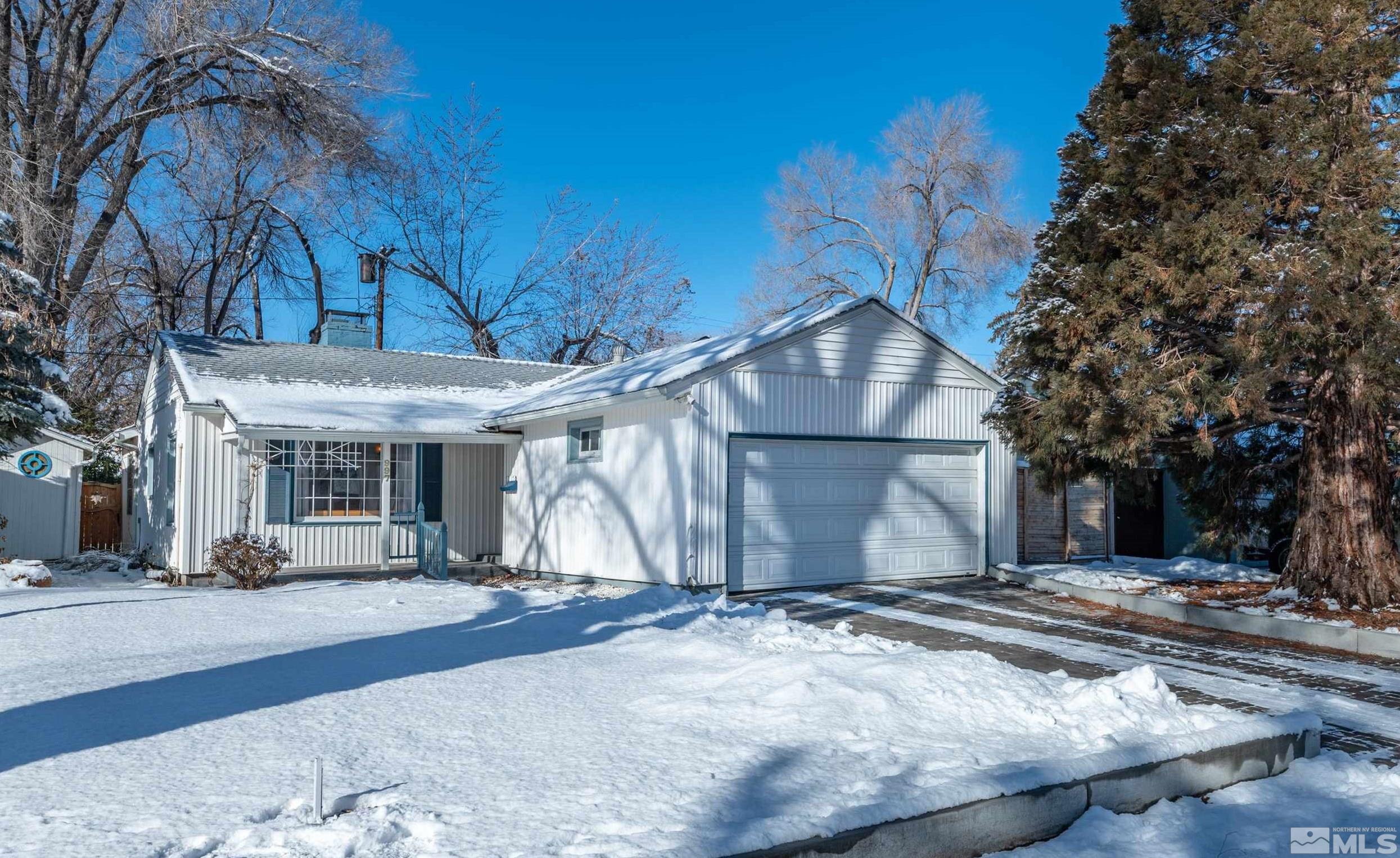 997 Meadow Street Reno, NV 89509 - Photo 1 of 33 a view of garage with large tree