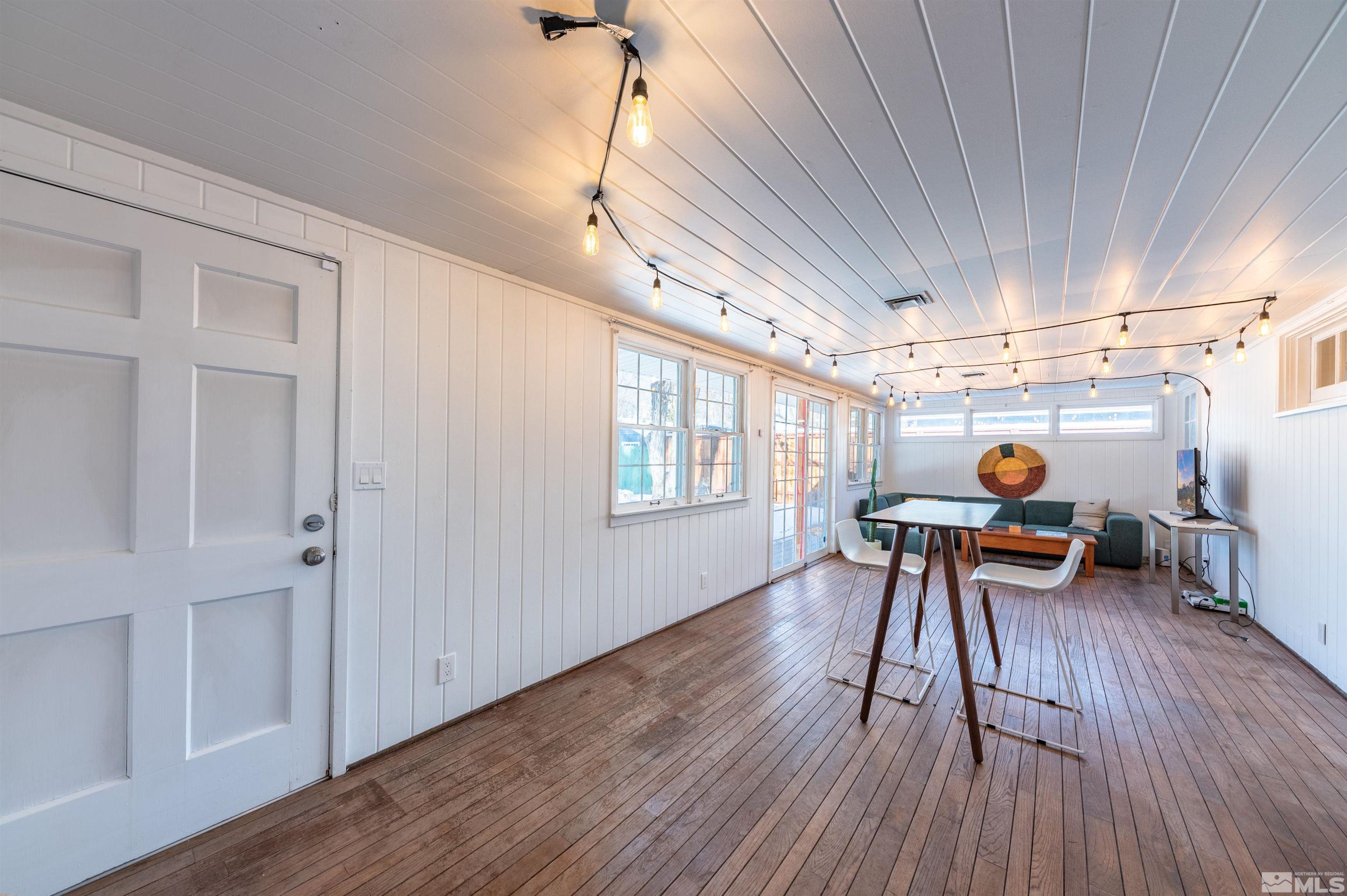 997 Meadow Street Reno, NV 89509 - Photo 23 of 33 a work room with furniture and a wooden floor
