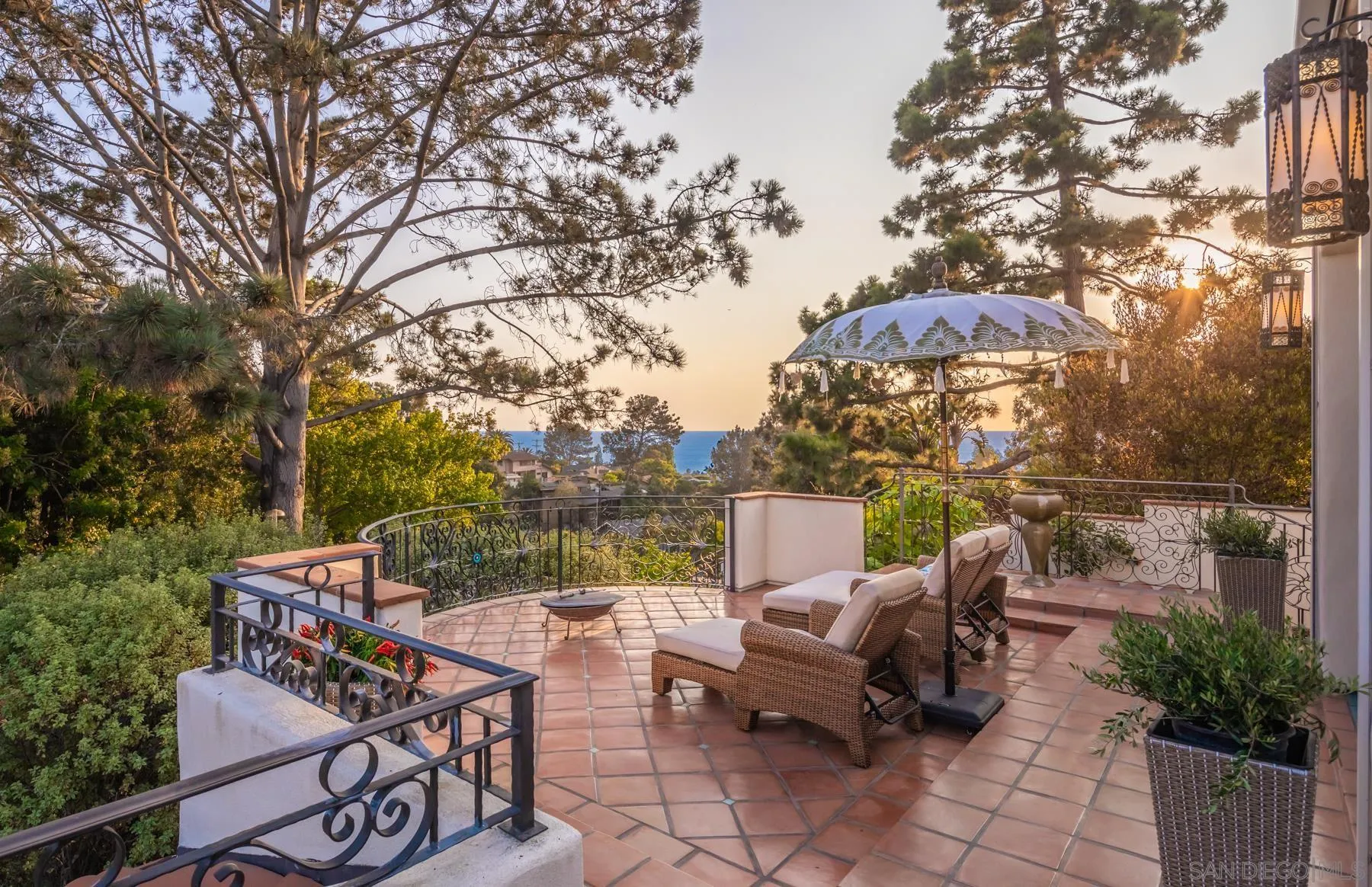 545 Rimini Road Del Mar, CA 92014 - Photo 16 of 34 an outdoor sitting area with furniture and wooden floor