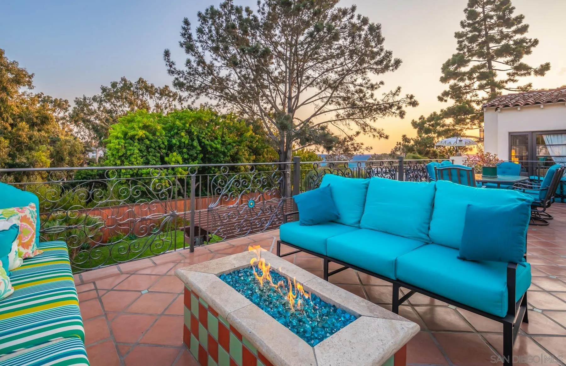 545 Rimini Road Del Mar, CA 92014 - Photo 17 of 34 a view of a patio with couches chairs and a potted plant