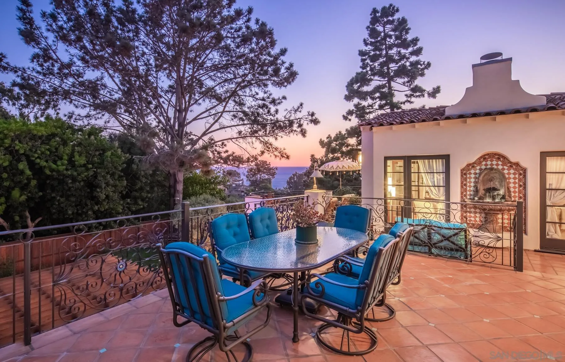 545 Rimini Road Del Mar, CA 92014 - Photo 19 of 34 a view of a dining room with furniture and chandelier