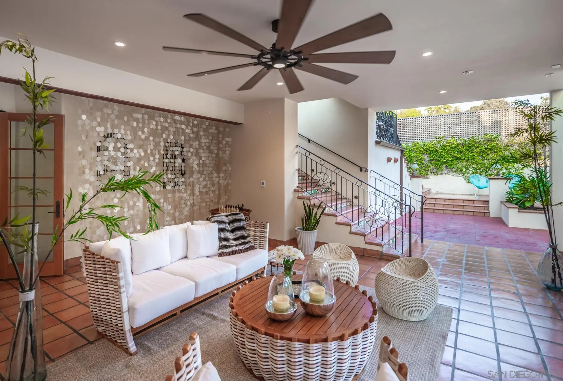 545 Rimini Road Del Mar, CA 92014 - Photo 24 of 34 a living room with furniture and a large window