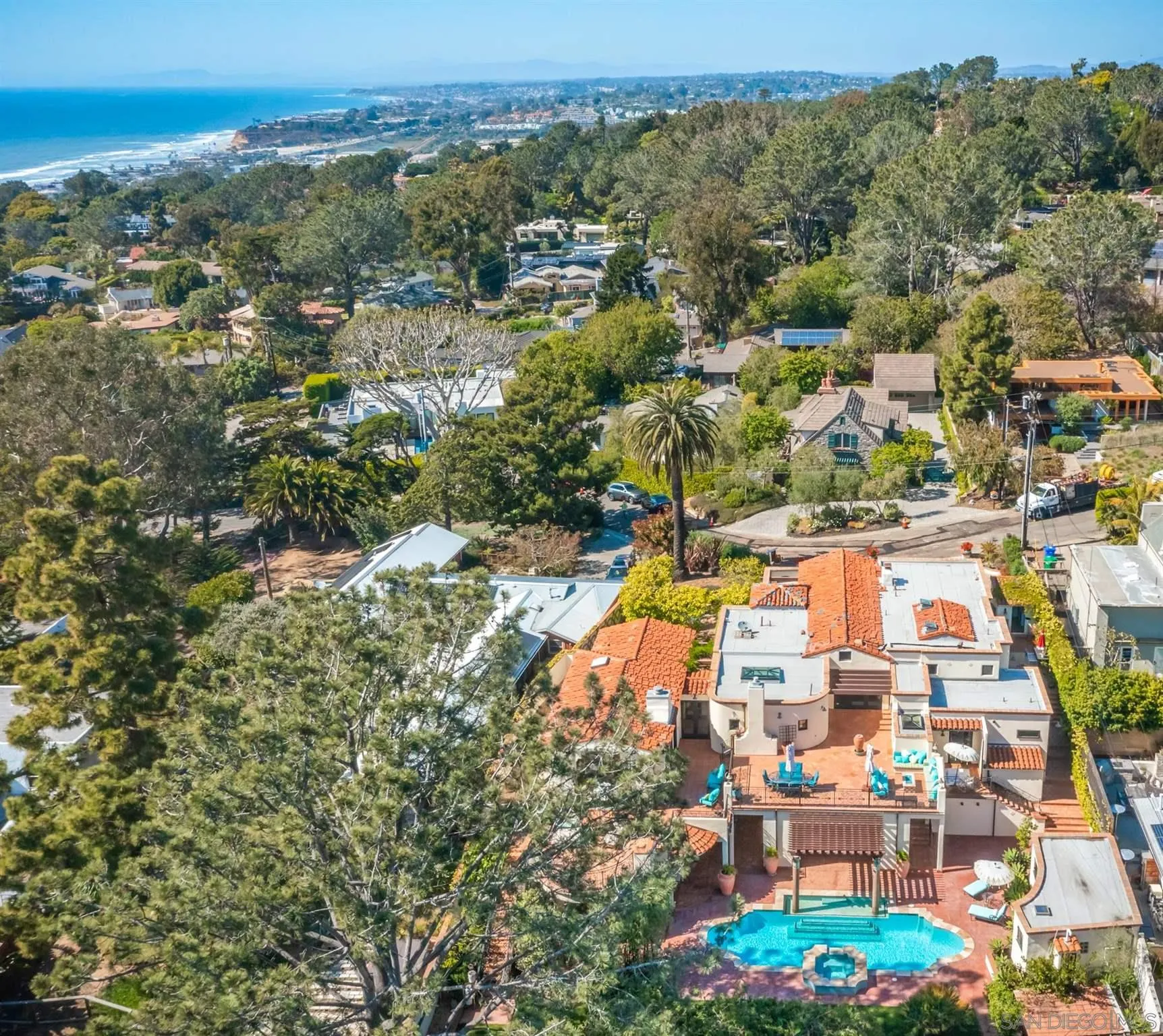 545 Rimini Road Del Mar, CA 92014 - Photo 32 of 34 an aerial view of residential houses with outdoor space and swimming pool