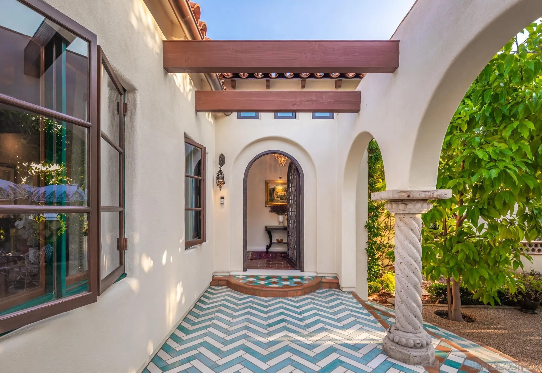 545 Rimini Road Del Mar, CA 92014 - Photo 5 of 34 a front view of a house with garden