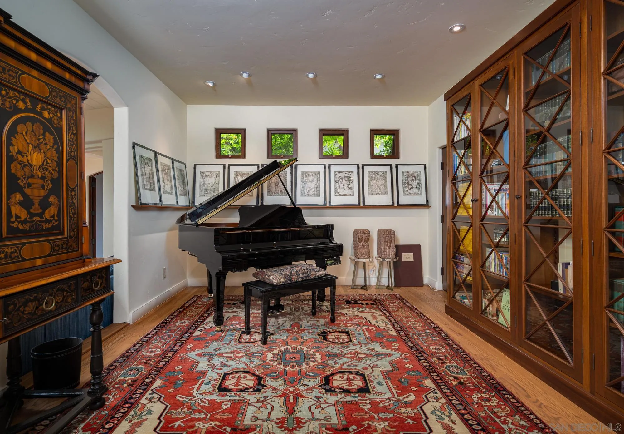545 Rimini Road Del Mar, CA 92014 - Photo 10 of 34 a living room with furniture and a fireplace