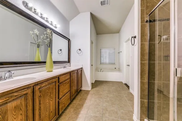 a bathroom with a sink a vanity and a mirror