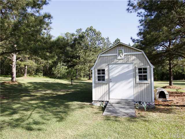 3521 Catlett Farm Road Wake Forest, NC 27587 - Photo 21 of 25 Storage shed/workshop with exterior lighting.