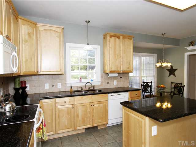 3521 Catlett Farm Road Wake Forest, NC 27587 - Photo 4 of 25 Kitchen newly remodeled with granite, ceramic floors and new cabinets. Large pantry, center island and updated appliances.
