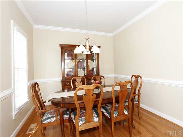 3521 Catlett Farm Road Wake Forest, NC 27587 - Photo 7 of 25 Formal Dining has new hardwood floors, crown molding and chairrail.