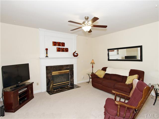 3521 Catlett Farm Road Wake Forest, NC 27587 - Photo 9 of 25 Open to Sunroom and Kitchen w/gas logs and marble surround. Mantle has beautiful molding above!