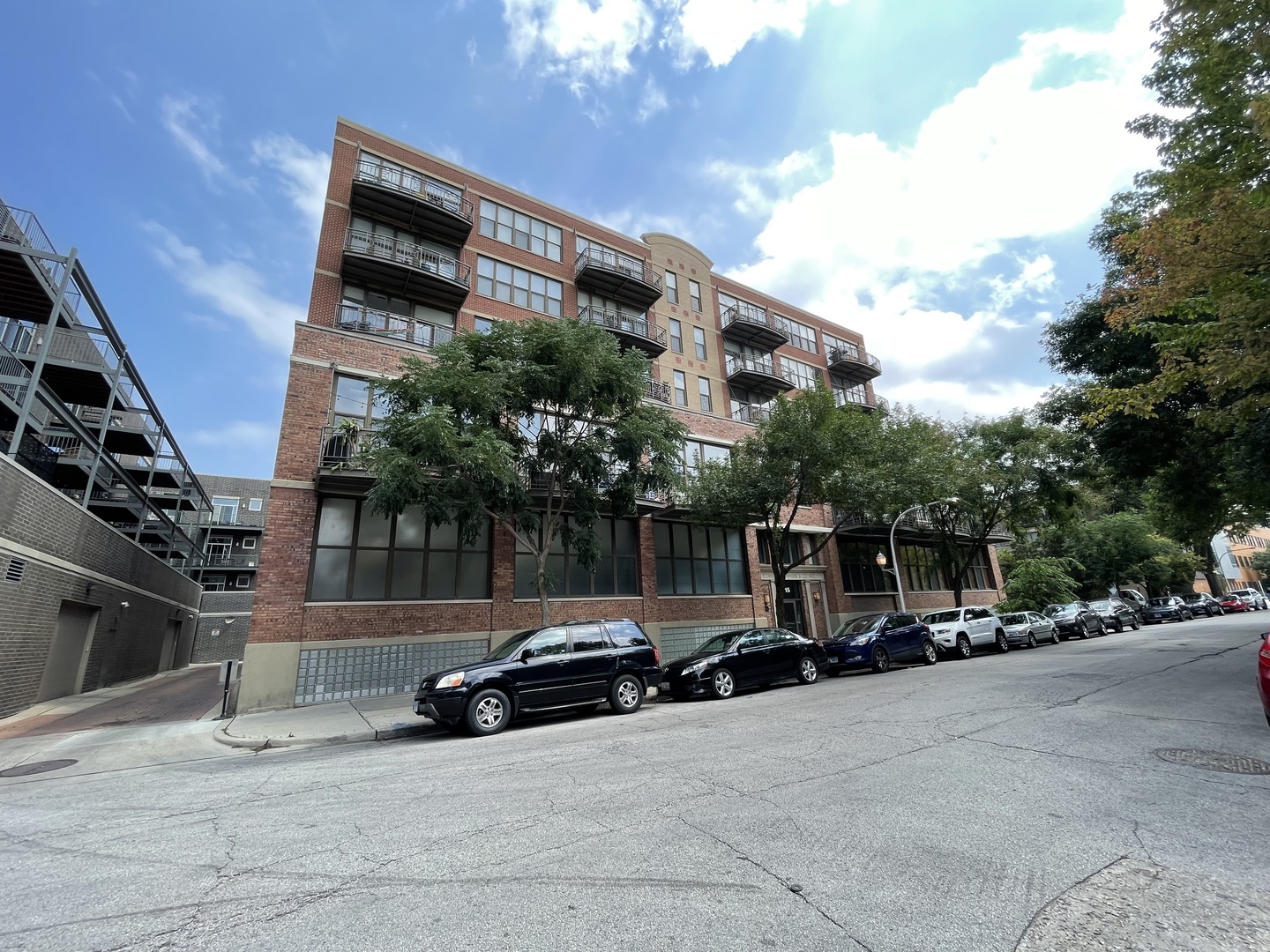 15 South Throop Street, Unit 308 Chicago, IL 60607 - Photo 1 of 4 a car parked on the side of a street