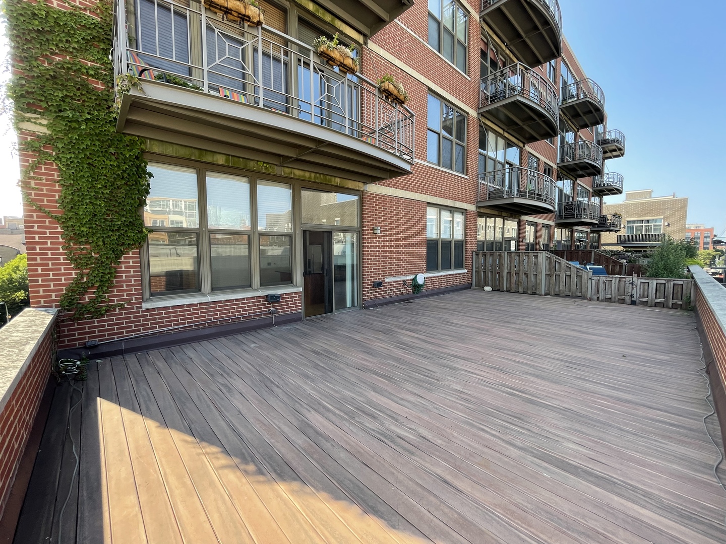 15 South Throop Street, Unit 308 Chicago, IL 60607 - Photo 2 of 4 a view of a building with a balcony