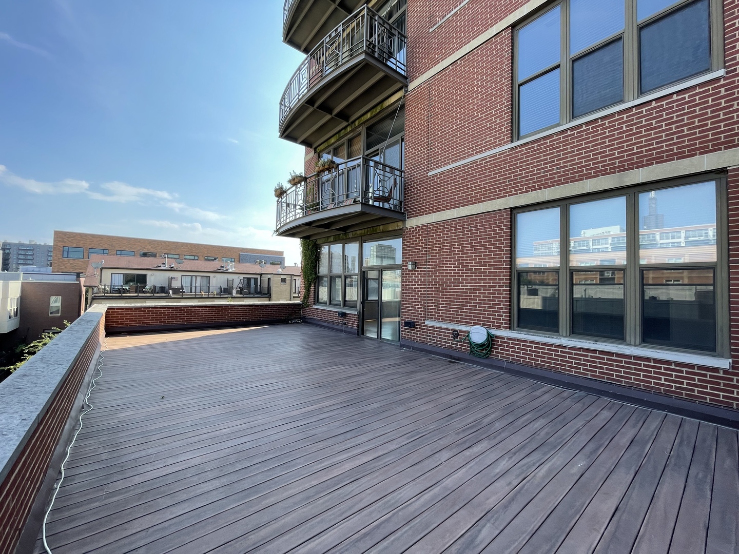 15 South Throop Street, Unit 308 Chicago, IL 60607 - Photo 3 of 4 a view of a house with a deck