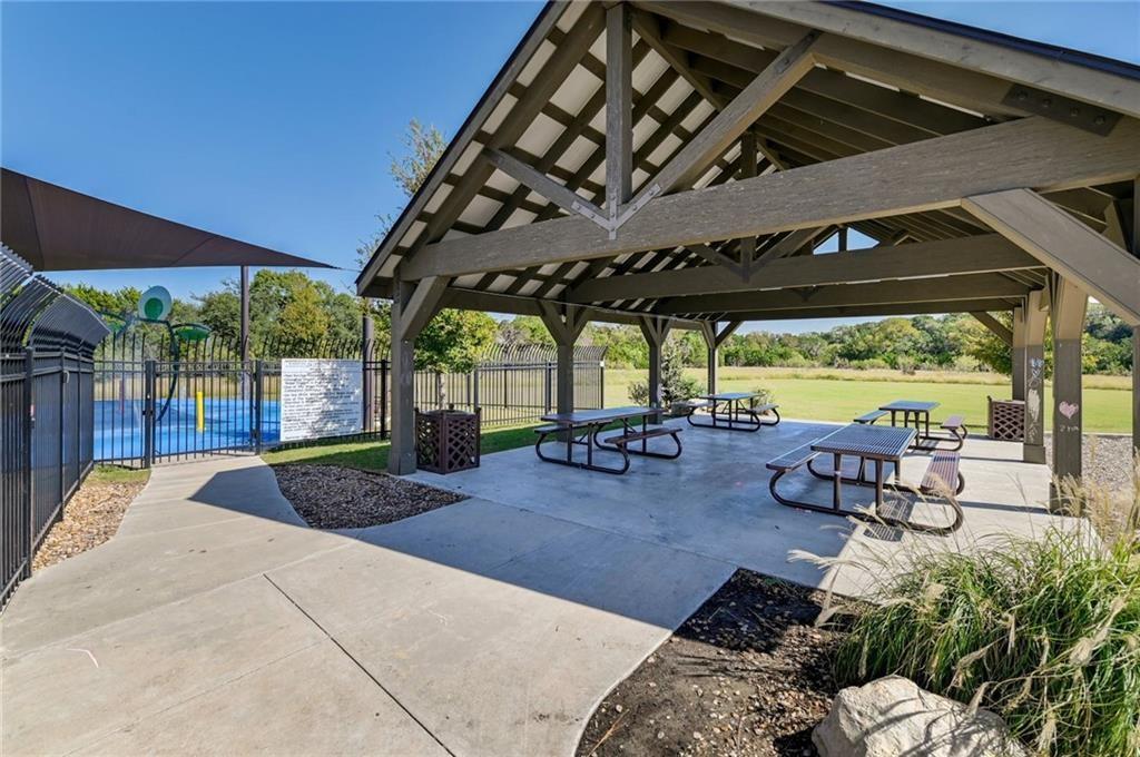 375 Housefinch Loop Leander, TX 78641 - Photo 26 of 28 An open-air pavilion with exposed timber framing sits adjacent to the community recreation facilities.