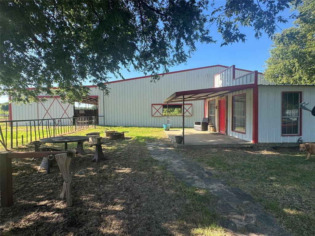 377 Private Road 3249, Unit ARENA Decatur, TX 76234 - Photo 6 of 40 a view of a house with backyard and sitting area