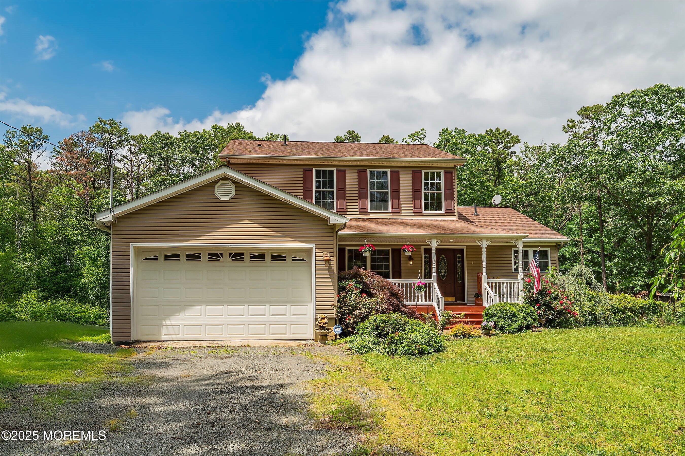 10 Hillside Avenue Tuckerton, NJ 08087 - Photo 1 of 46 a front view of a house with a garden
