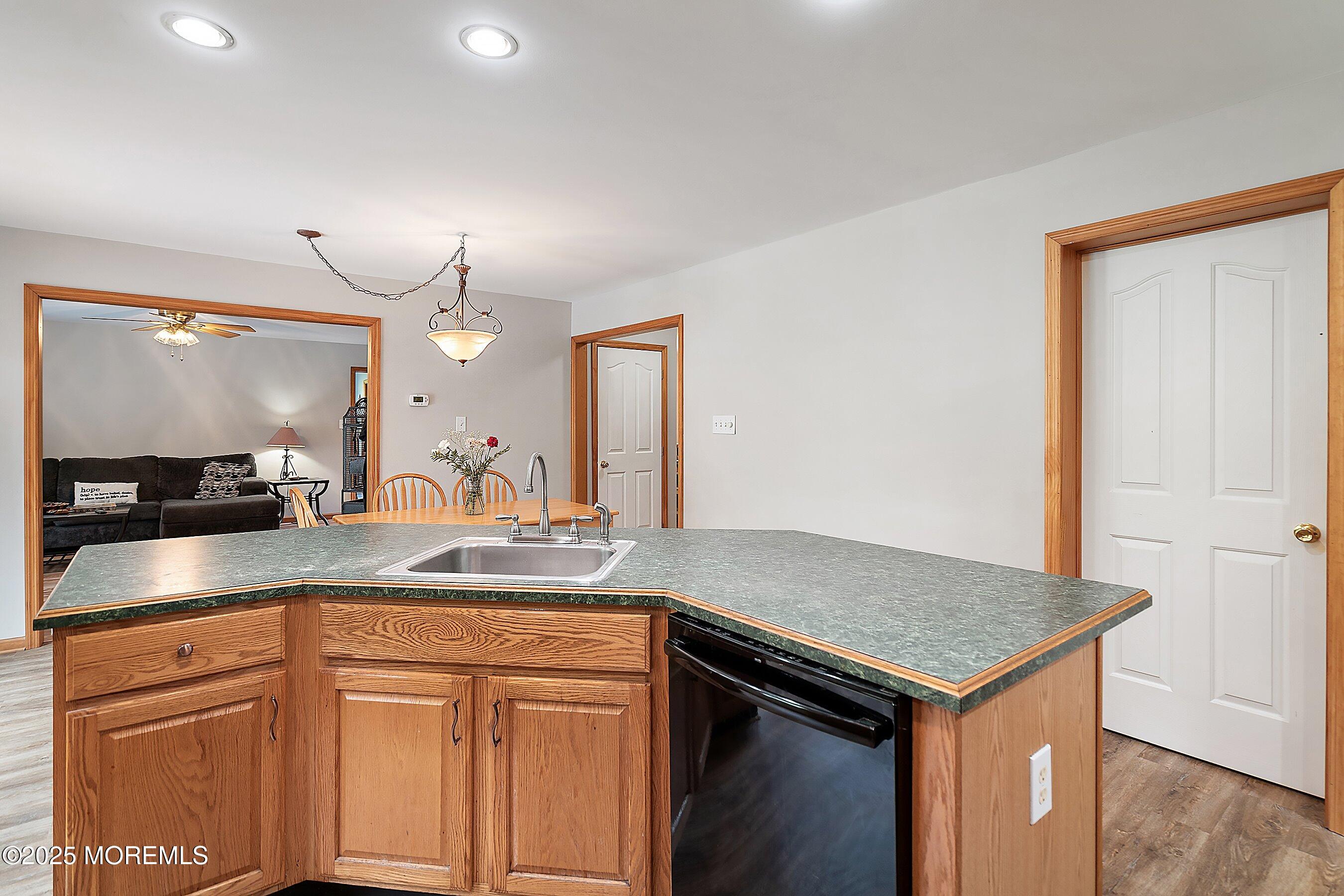 10 Hillside Avenue Tuckerton, NJ 08087 - Photo 16 of 46 a kitchen with a sink and a refrigerator