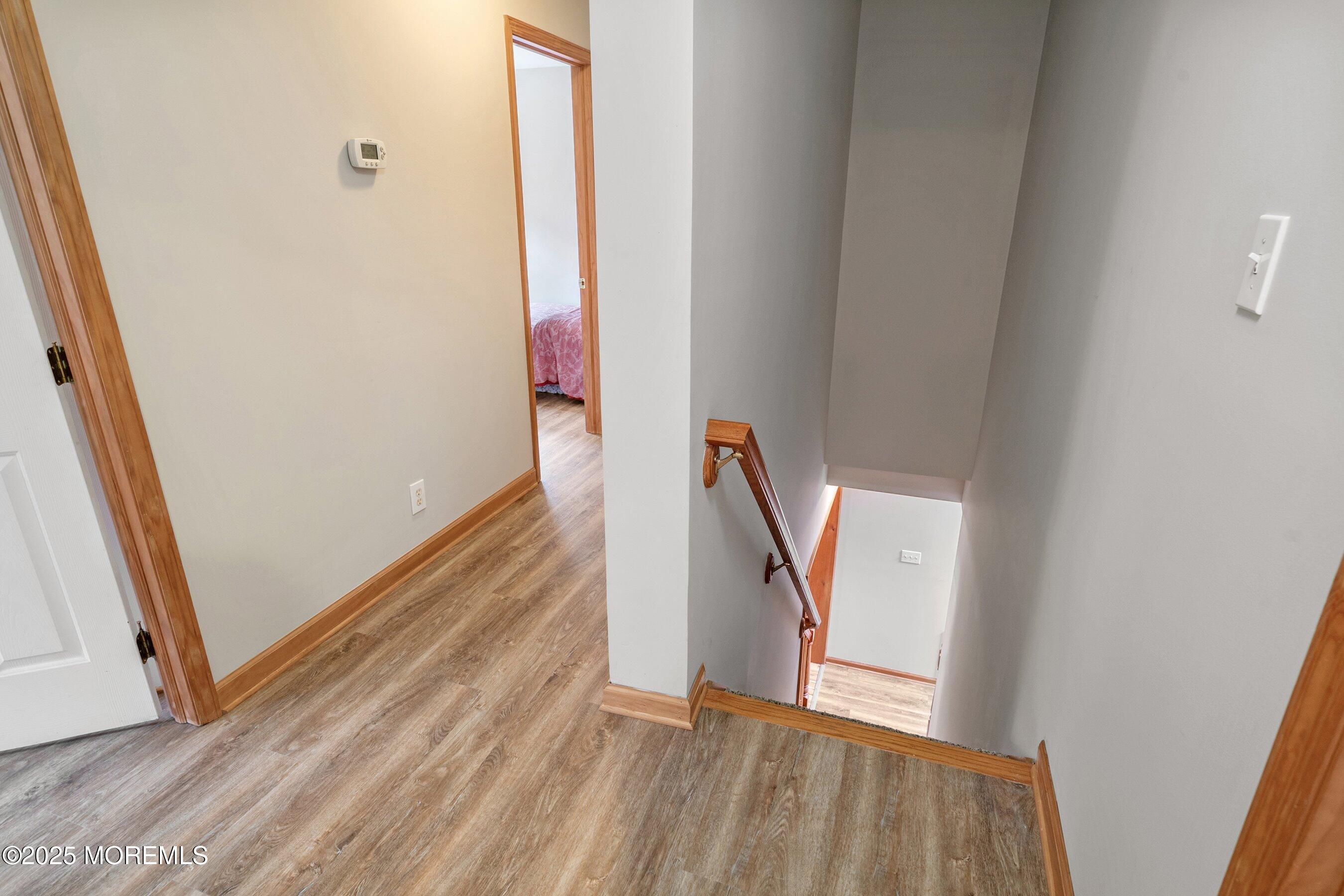 10 Hillside Avenue Tuckerton, NJ 08087 - Photo 27 of 46 a view of a hallway with wooden floor and stairs