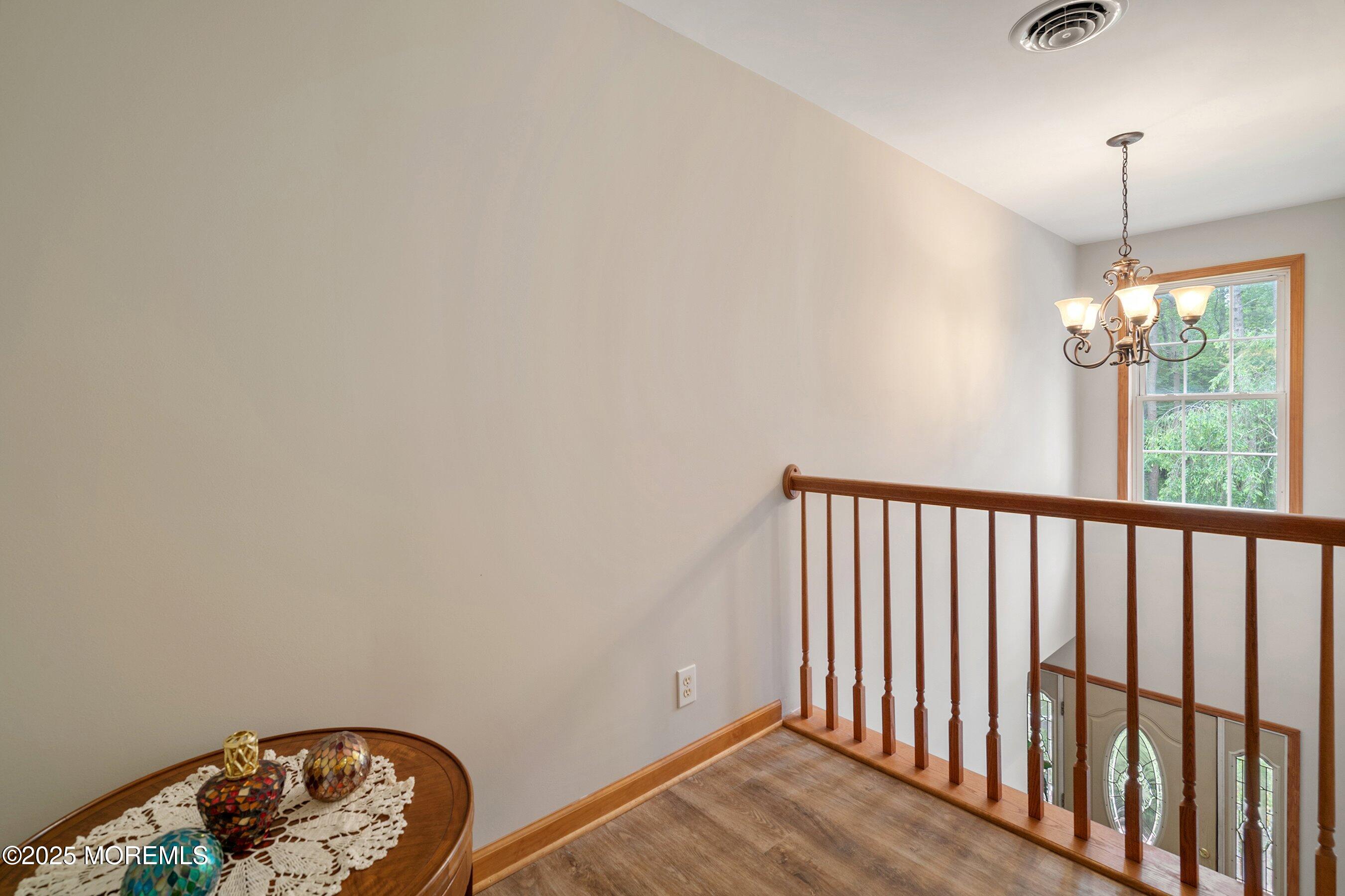 10 Hillside Avenue Tuckerton, NJ 08087 - Photo 28 of 46 a view of wooden floor and a chandelier in a room