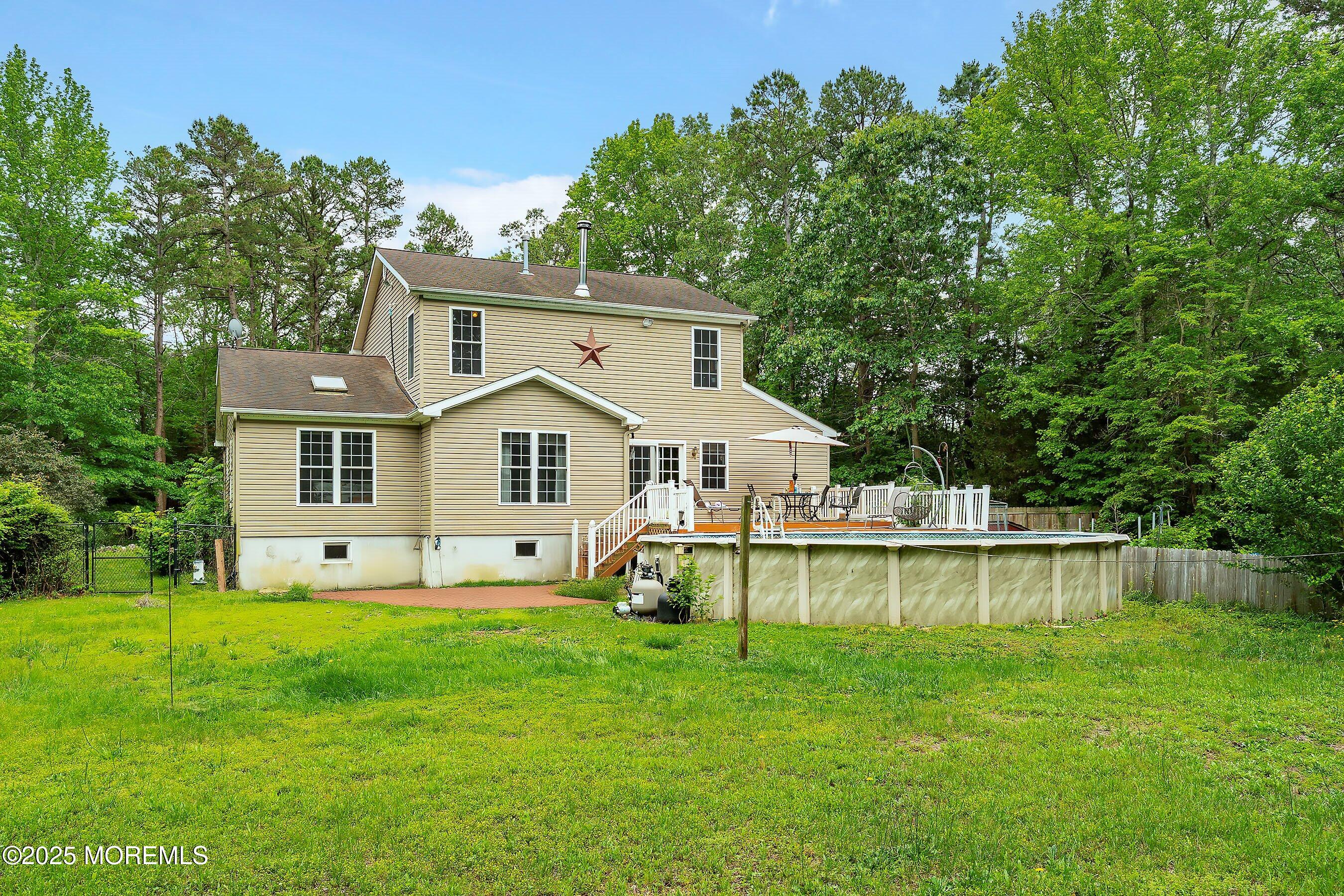 10 Hillside Avenue Tuckerton, NJ 08087 - Photo 38 of 46 a front view of a house with a yard table and chairs