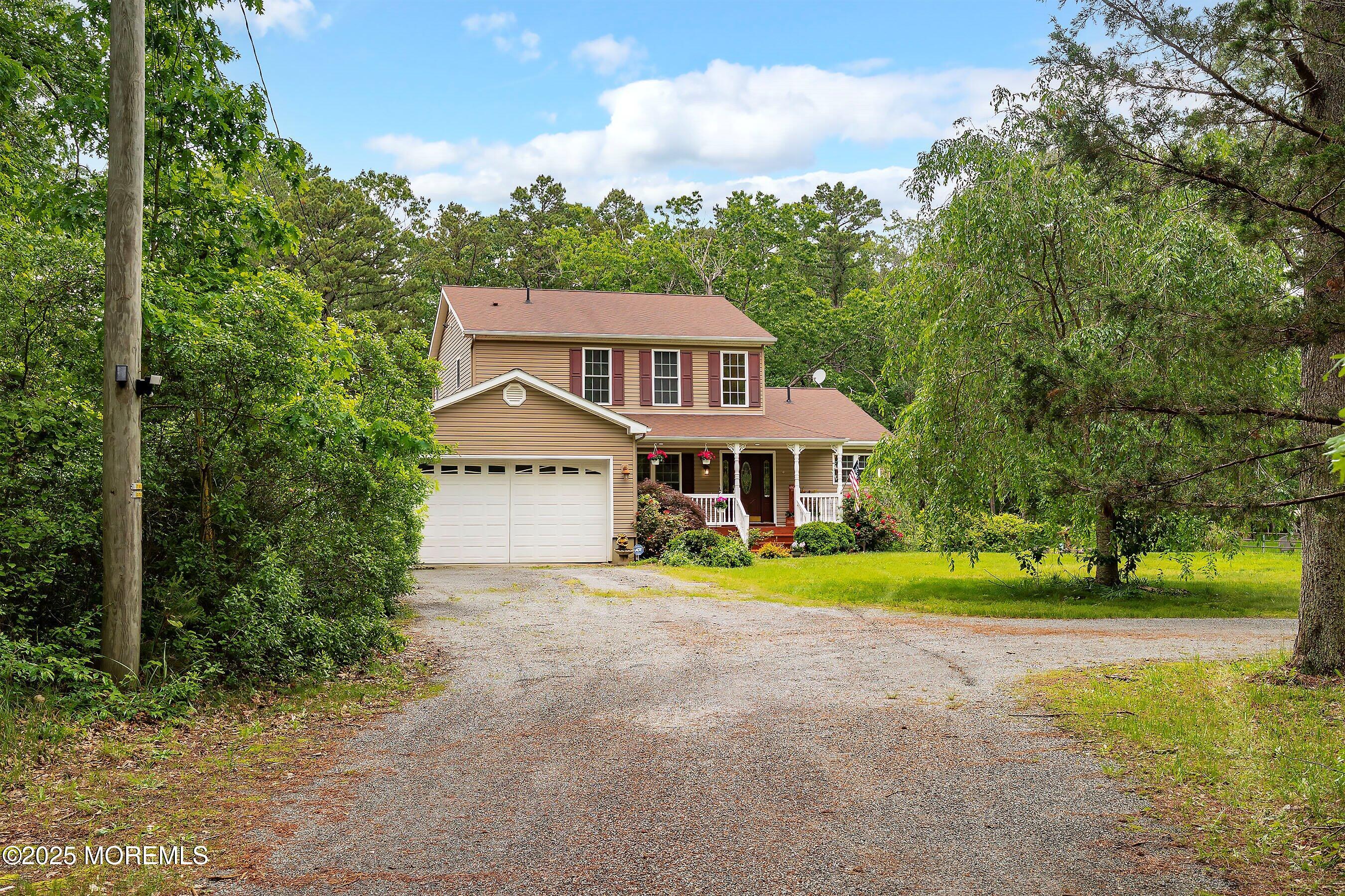 10 Hillside Avenue Tuckerton, NJ 08087 - Photo 4 of 46 a front view of a house with a yard and trees
