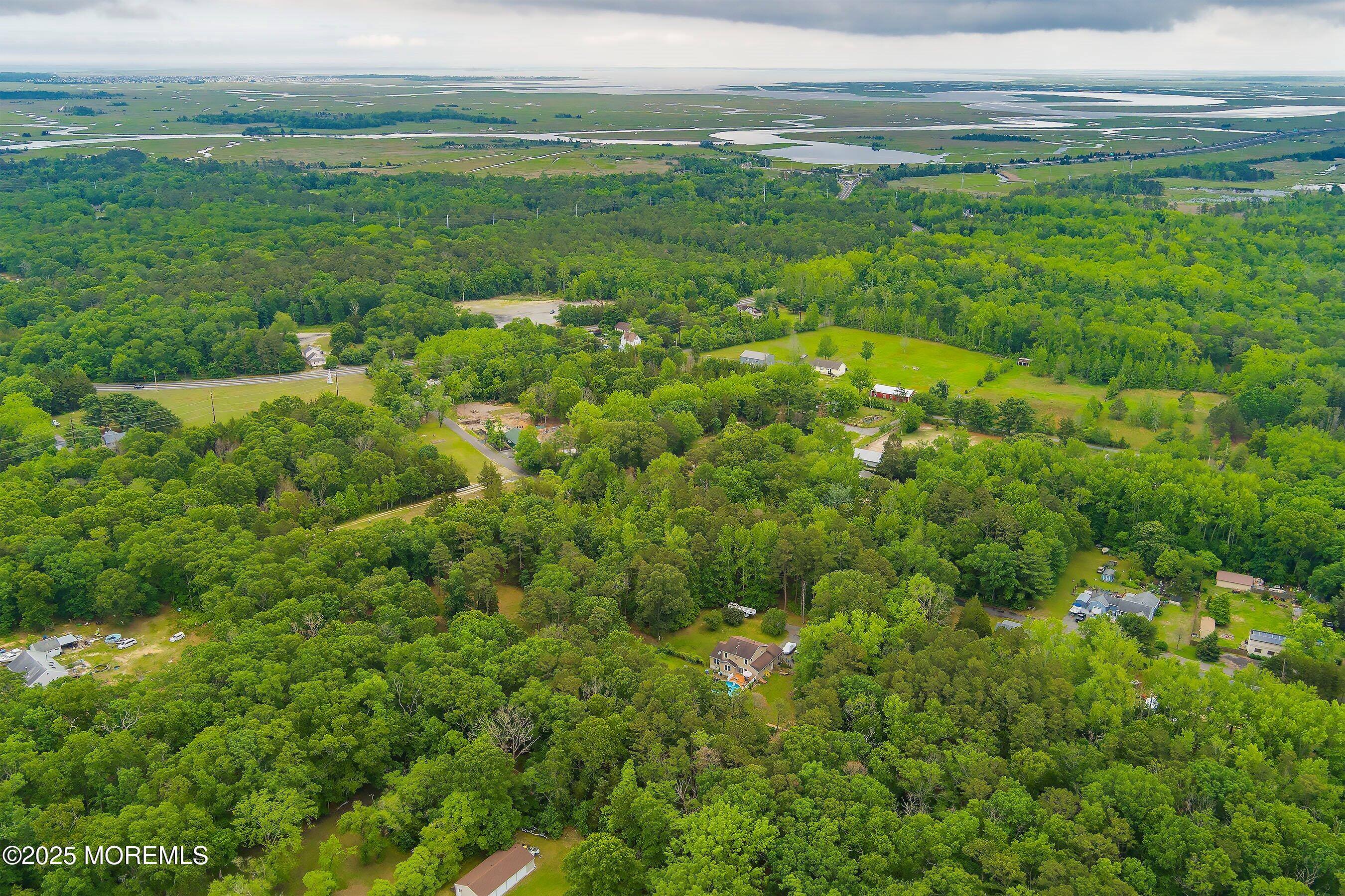 10 Hillside Avenue Tuckerton, NJ 08087 - Photo 42 of 46 a view of a field with an ocean and trees